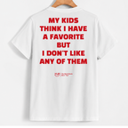 White short-sleeve T-shirt hanging on a wooden hanger, showing the back with bold red text that reads, 'MY KIDS THINK I HAVE A FAVORITE BUT I DON'T LIKE ANY OF THEM.' A small red YUB logo appears near the lower back.