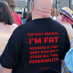 A bald man seen from behind wearing a black graphic t-shirt with bold red text that reads, 'THE ONLY REASON.