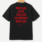 A black short-sleeve t-shirt hanging on a wooden hanger, showing the back with bold red text that reads 'When you Excel They will spreadsheet about you'.
