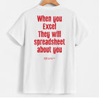 White short-sleeve t-shirt hanging on a wooden hanger, featuring a humorous red text graphic on the back that reads 'When you Excel They will spreadsheet about you' with a small 'XLF The Excel Fan Club' logo below.