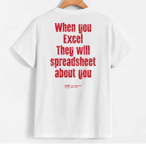 White short-sleeve t-shirt hanging on a wooden hanger, featuring a humorous red text graphic on the back that reads 'When you Excel They will spreadsheet about you' with a small 'XLF The Excel Fan Club' logo below.